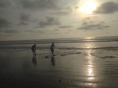 Fisherman work the nets off shore. 